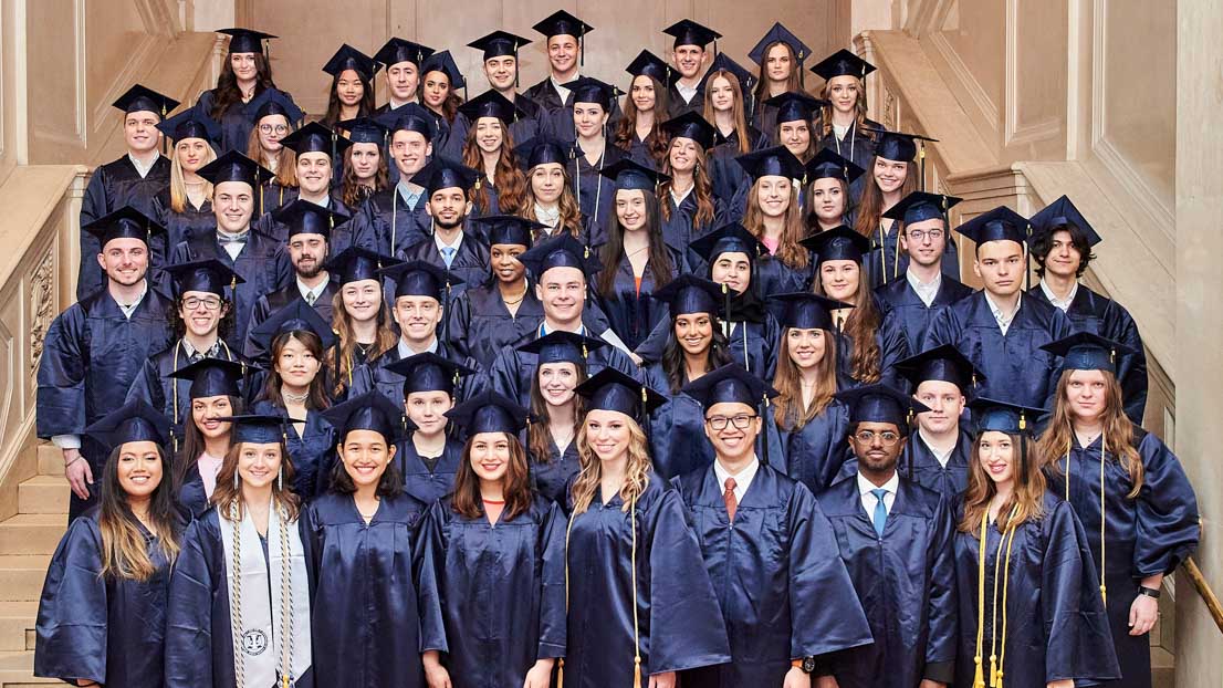 group in rows on steps, Webster University in Vienna commencement 2022