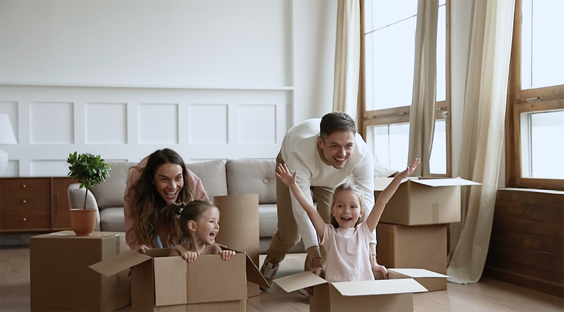 Family of four having fun at home