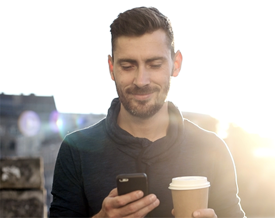 Man looking at this mobile phone